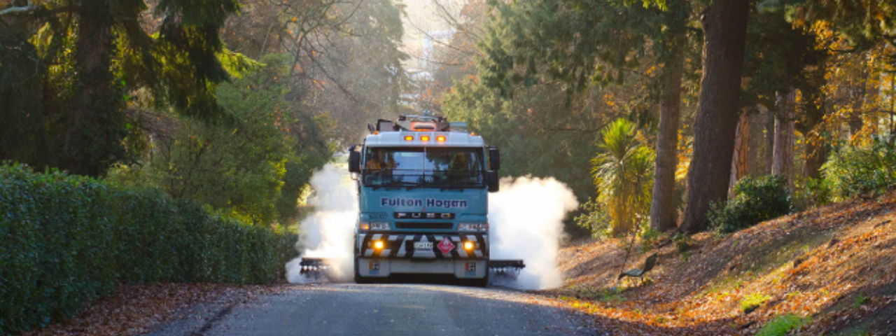 Truck coming down a country road with Fulton Hogan written across the front
