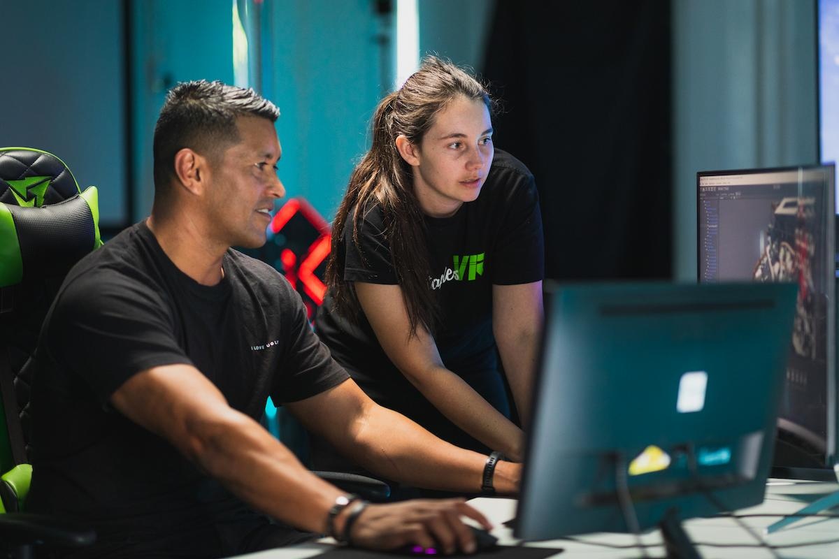 Man and woman working on computer