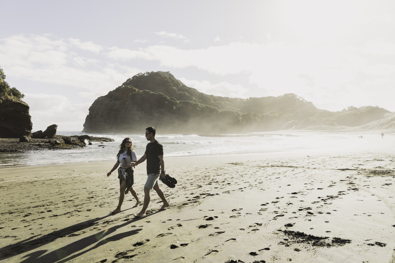 Man and woman enjoying a beach walk