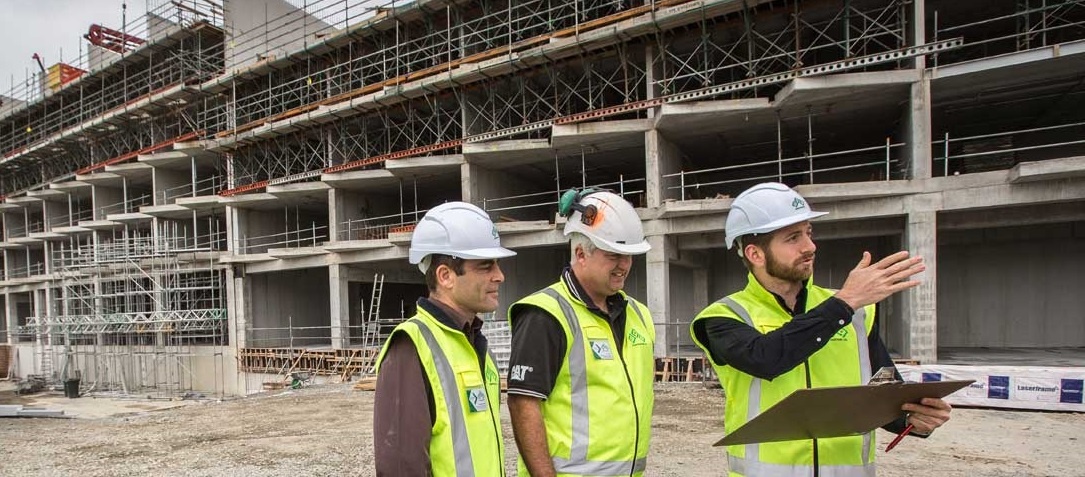 Three construction workers on site