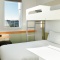 Interior king room with bunk bed at the ibis Budget Auckland Airport hotel.