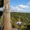 two people riding a EcoZip zipliner a tourism adventure in Auckland