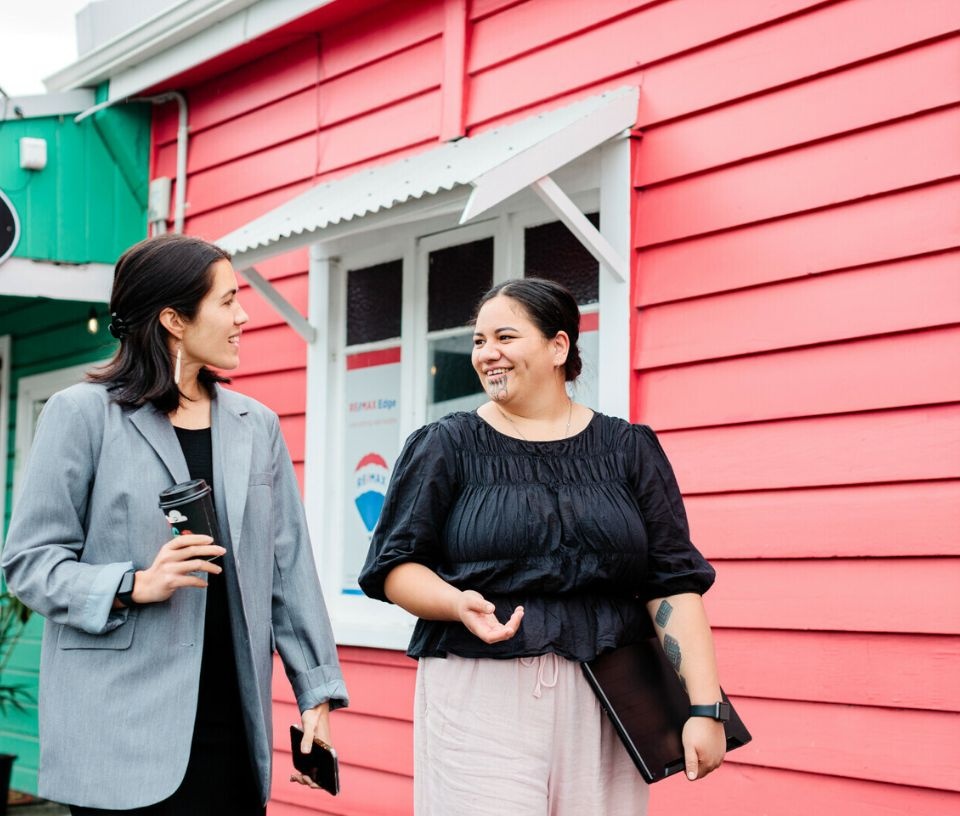 Tech Auckland - People - Women colleagues walking with coffees