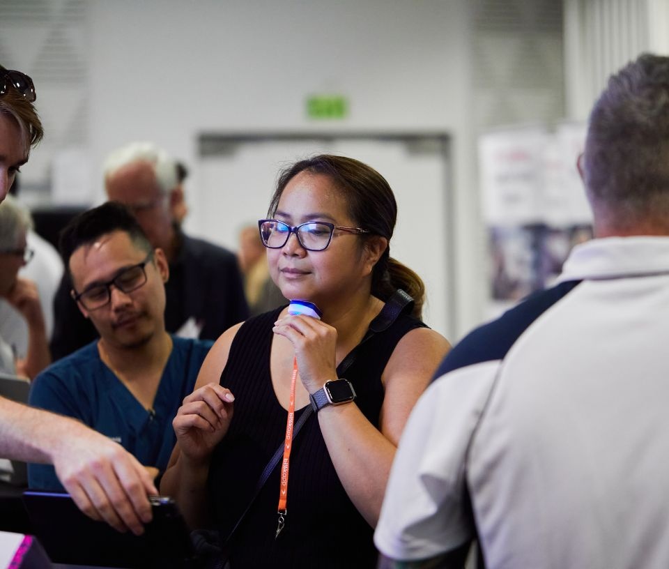 Tech Auckland - Community - Woman at Medtech iQ trying technology