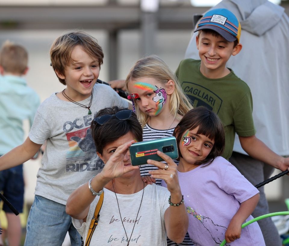 Tech Auckland - Place - Family taking a selfie at Auckland event