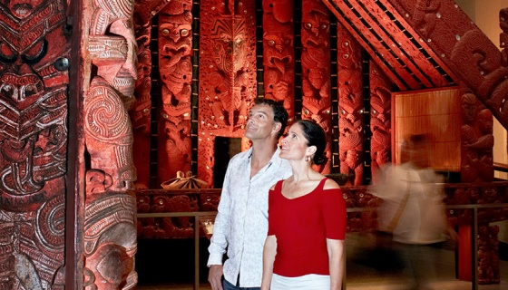 A couple in awe at Auckland Museum's Maori exhibition